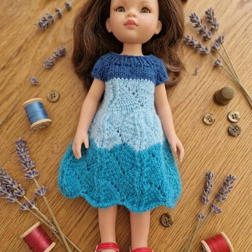 Handmade knitted doll clothes in various colors