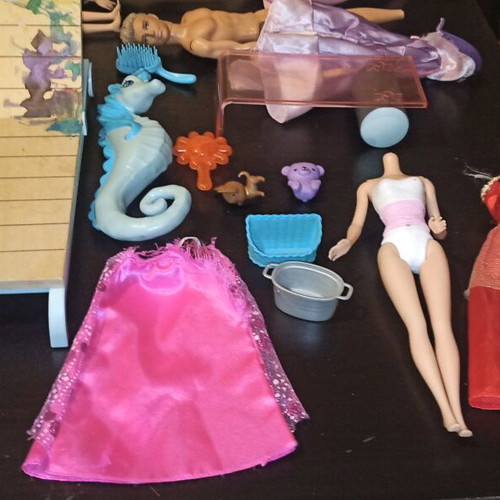 Barbie and other toys used, in moderate condition