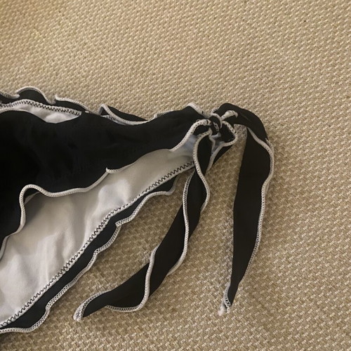 M&D black swimsuit used, fits small and medium sizes