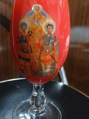 Red glass candlestick with double saints depiction, 17cm