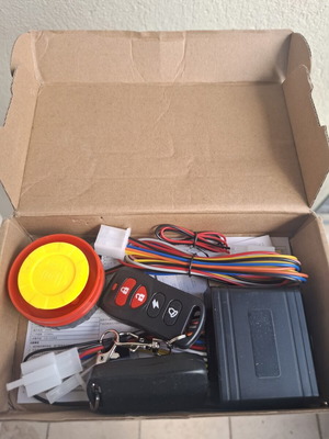 Motorcycle alarm system new with remote start and keyless drive