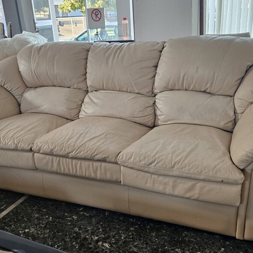 Leather three-seater sofa used, beige color