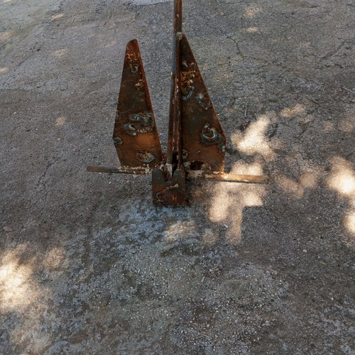 Anchor used for small boat, old and rusty