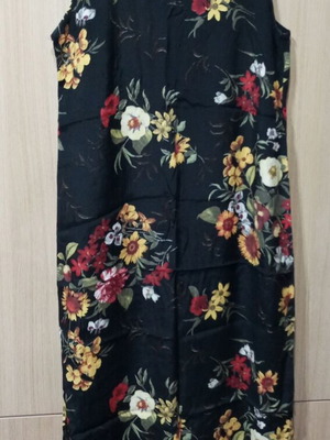Long women's dress used with multicolored flowers