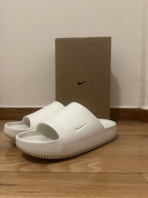 Nike men's white Calm slides size 42.5, used with signs of wear