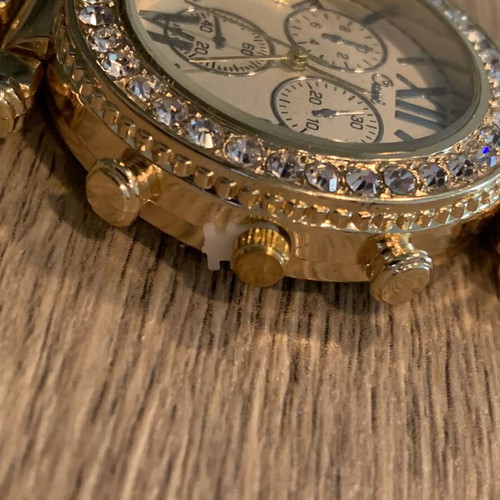 Golden wristwatch, women's