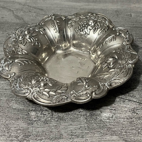 Decorative metal bowl used with embossed design
