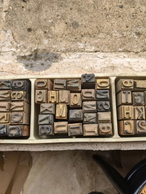 Large brass typography and bookbinding elements