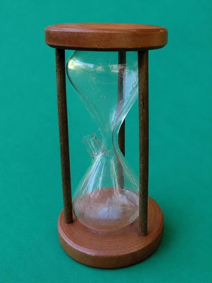 Vintage hourglass used with glass and natural wood frame