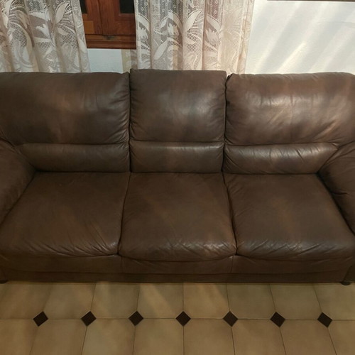 Two Sato three-seater leather sofas, dark brown