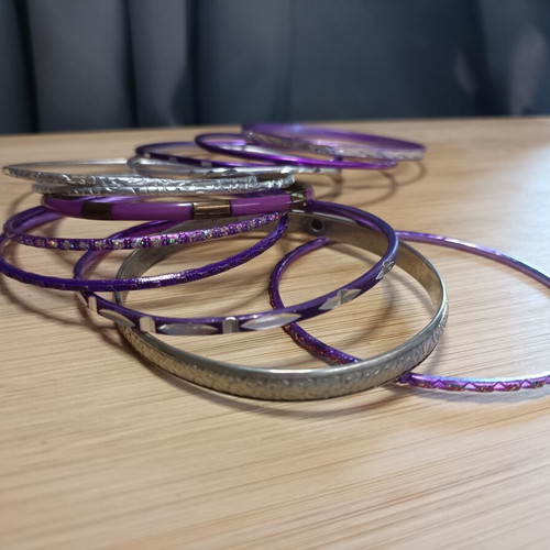 Set of purple and silver bracelets