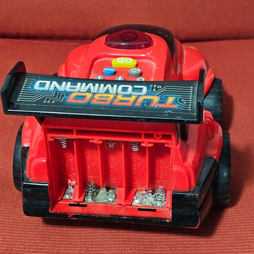 Toy car used with programmable functions, missing battery cover
