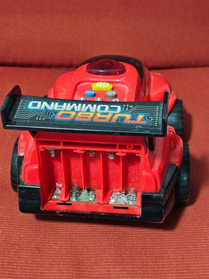 Toy car used with programmable functions, missing battery cover