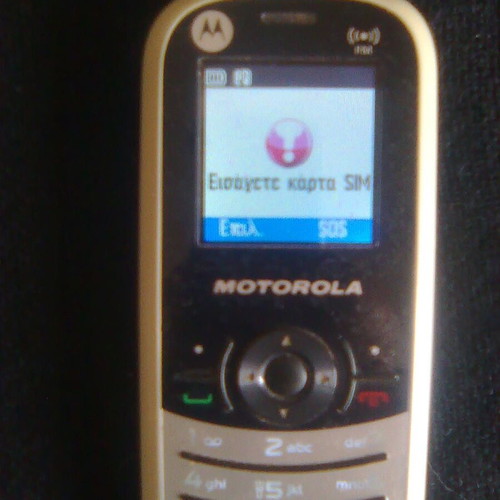 Motorola WX181 like new mobile phone with charger, headphones, and box