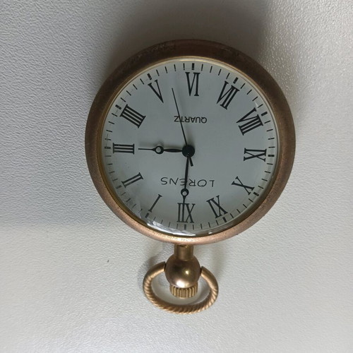 Vintage pocket watch used with wear from age