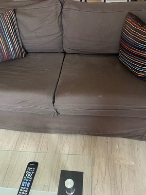 Two-seater sofa used with cushions and cover