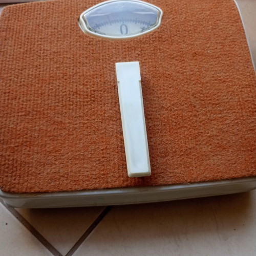 Vintage mechanical scale with carpet used