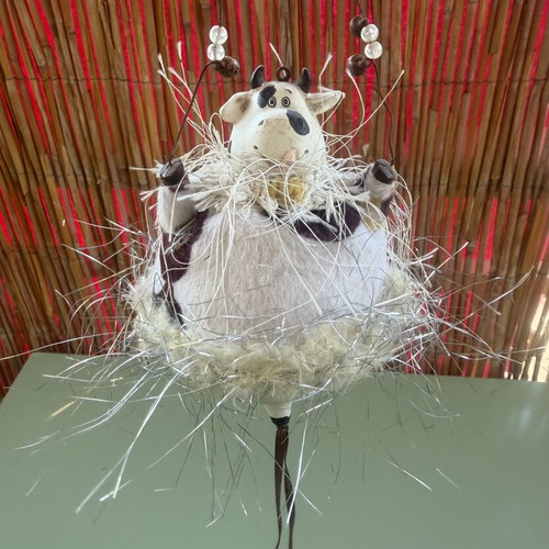 Hanging decorative ornament with fabric and ceramic cow