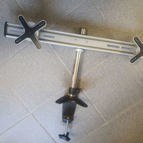 Dual monitor stand used, stable and practical arm