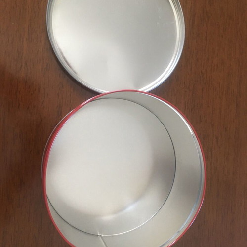 Metal tin used, round red with Munchmallows advertisement