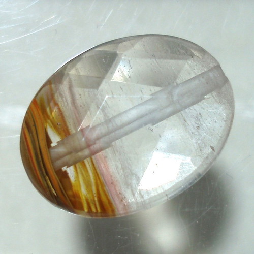 Quartz mineral with oxide inclusions like new, 14.70ct, with hole