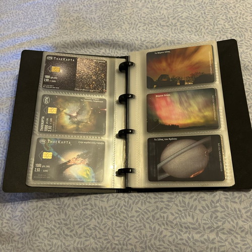 Phone card album with 32 universe-themed cards and 50 extra sleeves like new