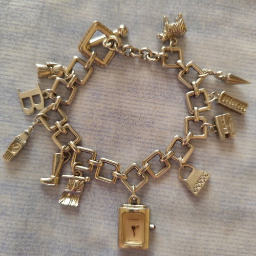 Burberry charm watch bracelet like new, silver plated finish