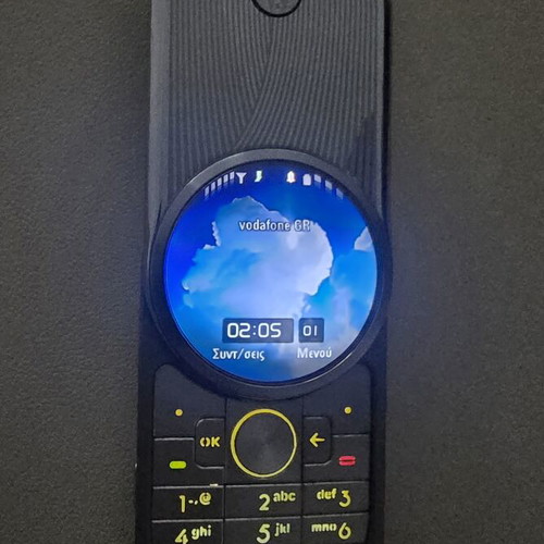 Motorola Aura phone like new, silver with spare battery and charger