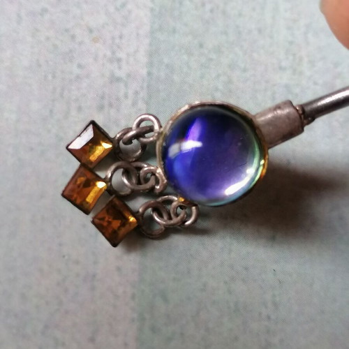 Aurora borealis navel piercing with color-changing crystal