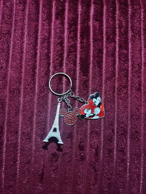 Authentic Disneyland keychain like new, silver with three charms