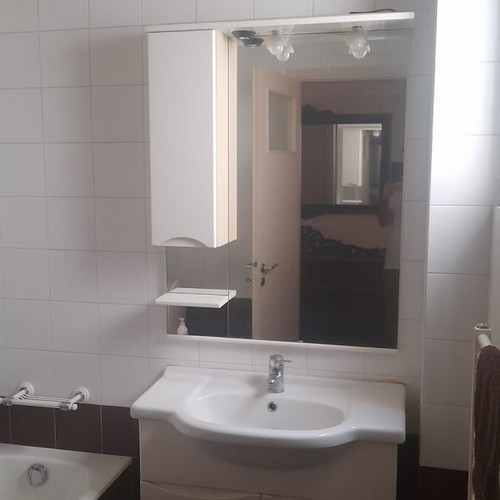 Bathroom furniture set used with sink and white mirror