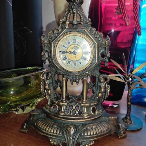 Vintage baroque brass mechanical mantel clock.