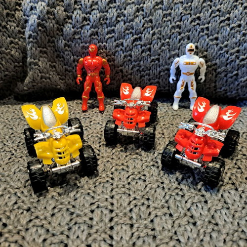Toy set with action figures and small ATV vehicles used