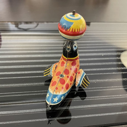 Seal with spinning ball vintage tin toy used