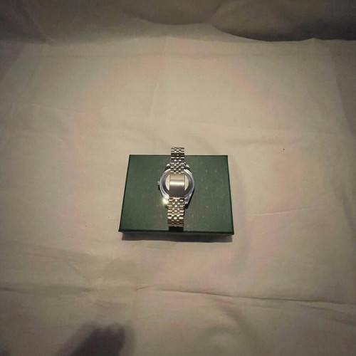 Seiko watch with blue dial and silver bracelet