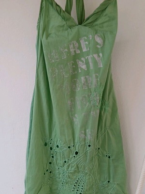 Green crochet dress like new with back design and faded letters