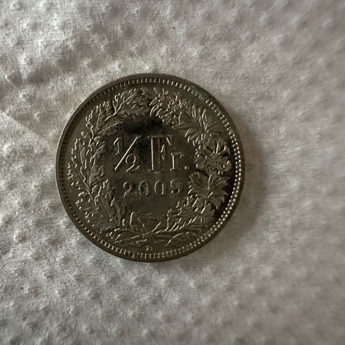 Half franc coin 2009 used
