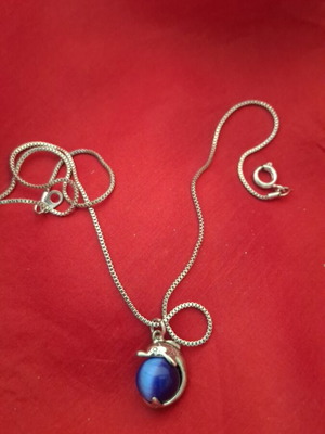 Necklace with dolphin and blue bead used