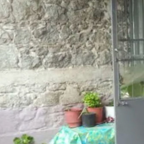 Stone detached house with plot within settlement in Lesvos