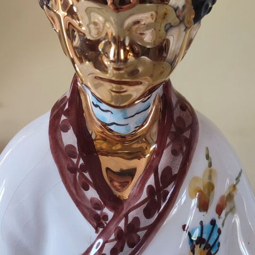 Vintage porcelain Buddha statue with gold details