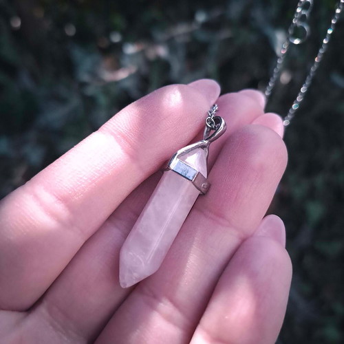 Rose quartz crystal pendant used with silver chain