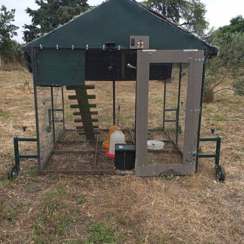 Mobile chicken coop used with automatic timer door