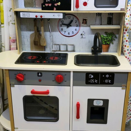 Children's wooden kitchen used with sounds and light