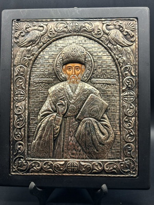 Silver embossed icon of Saint Nicholas used, with wooden base