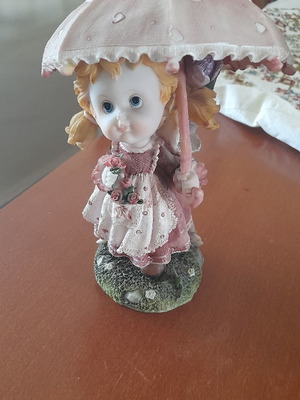 Vintage figurines girl and boy with umbrella new