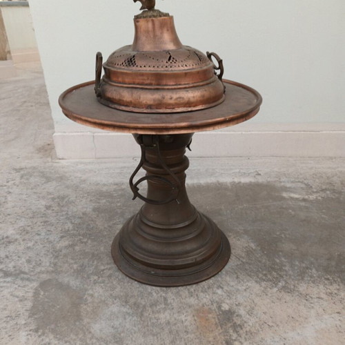 Old copper brazier used with brass handles and decorative bird