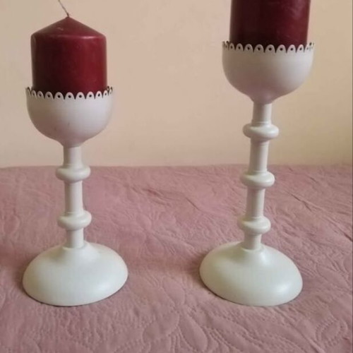 Set of two white metal candlesticks with candle like new
