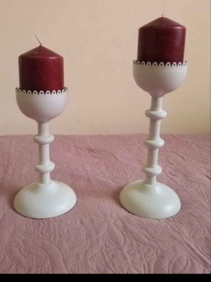 Set of two white metal candlesticks with candle like new