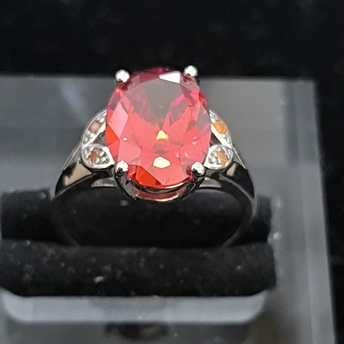 Ring with Large Red Ruby-Colored Stone and Decorative Stones