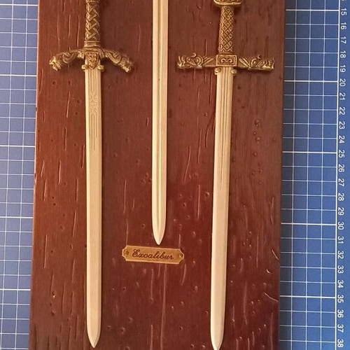 Decorative historical swords used with wooden base and metal mounts